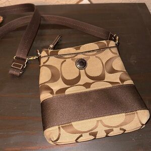 Coach crossbody and wristlet.